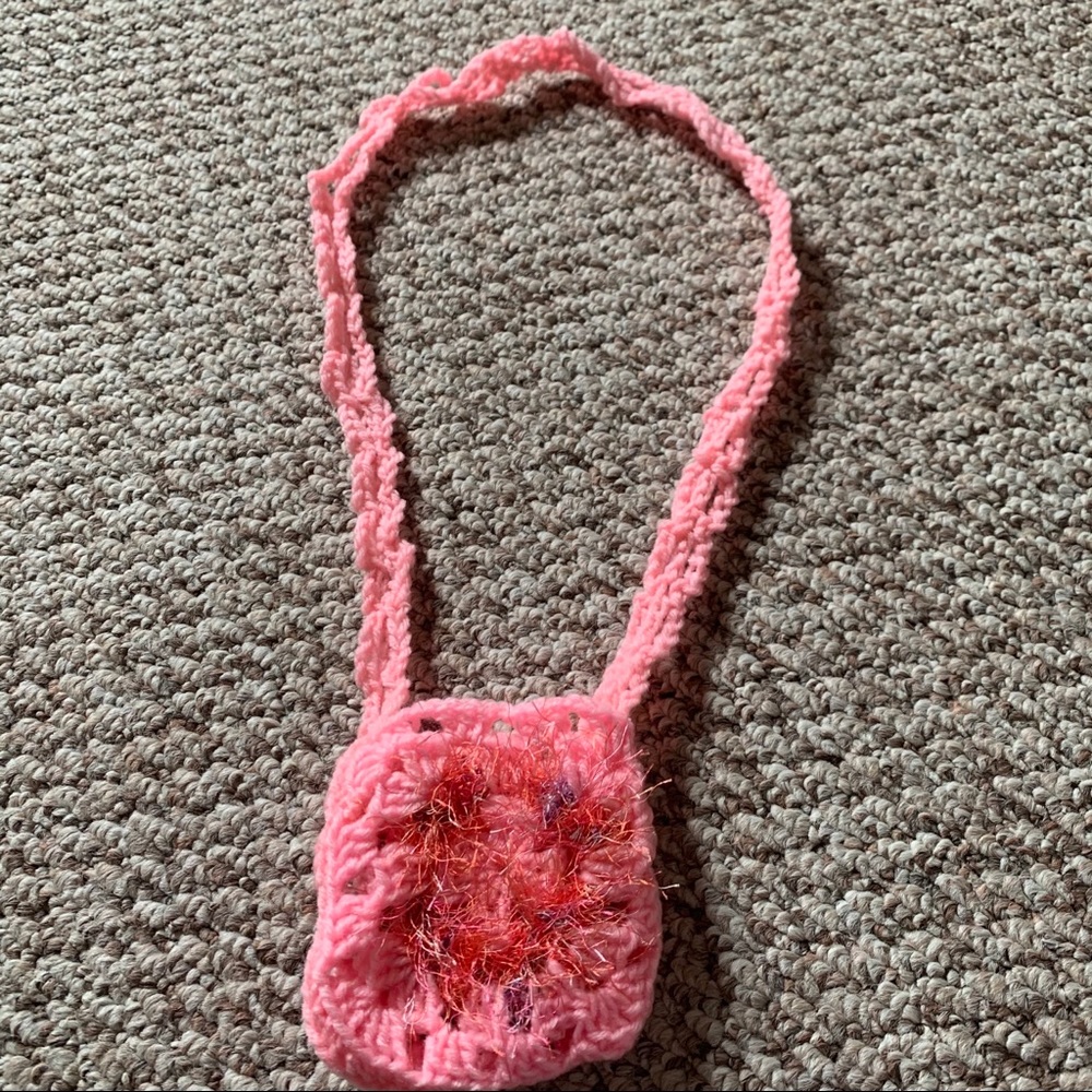 Hand knitted pink pouch